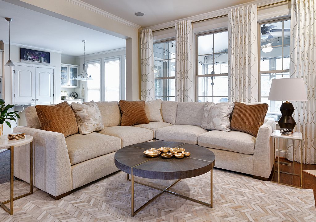 A neutral transitional living room from Inspired Interiors, a Decorating Den franchise.